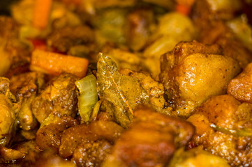 Roast meat, onions, carrots and spices, boiling in oil