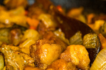 Roast meat, onions, carrots and spices, boiling in oil