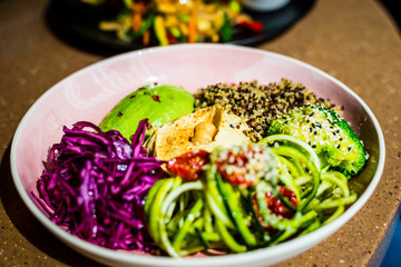 Buddha Bowl with Avocado, Tahini, Quinoa, Red Cabbage and other Healthy Vegetables