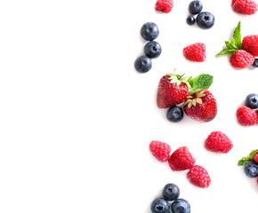 Delicious ripe berries on white background, top view