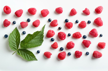 Delicious ripe berries on white background, top view