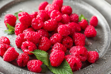 Delicious fresh ripe raspberries on plate