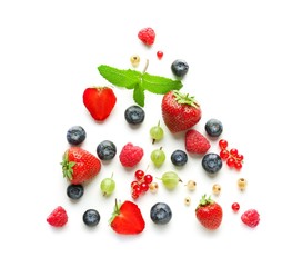 Fototapeta na wymiar Delicious ripe berries on white background, top view