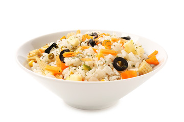Bowl with tasty boiled rice and vegetables on white background
