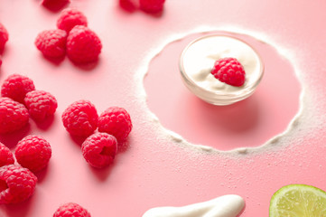 Composition with fresh ripe raspberries on color background