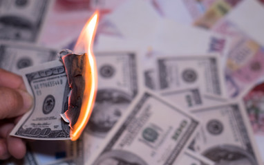 Burning one hundred dollar