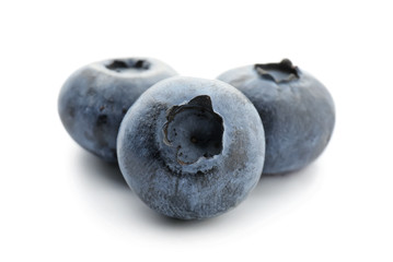 Ripe blueberries on white background