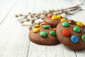 Tasty chocolate cookies on wooden table