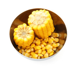 Bowl with tasty corn kernels and cobs on white background