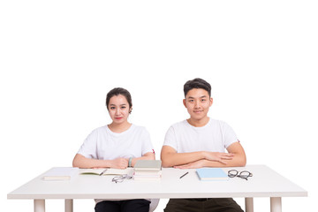 Young students studying together at table with books. Back to school