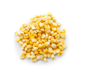 Pile of ripe corn kernels on white background