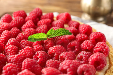 Delicious raspberry cheesecake on table, closeup