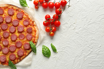 Tasty Pepperoni pizza on white table