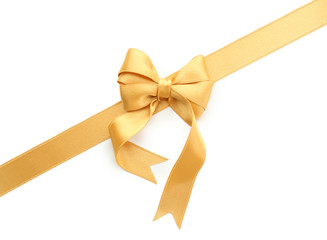 Golden ribbon with bow on white background