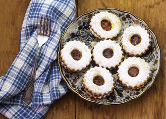 Traditional algerian cookies with apricot jam on rustic wooden. Holiday concept