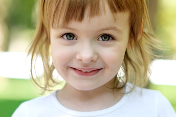 Girl in a white T-shirt in the park