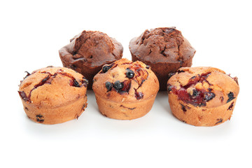 Sweet tasty muffins on white background