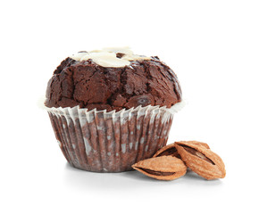 Sweet tasty chocolate muffin with almonds on white background