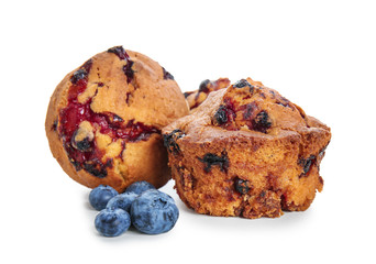 Sweet tasty muffins with blueberries on white background