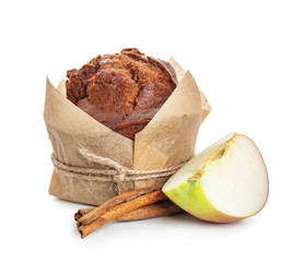 Sweet tasty muffin with apple and cinnamon on white background
