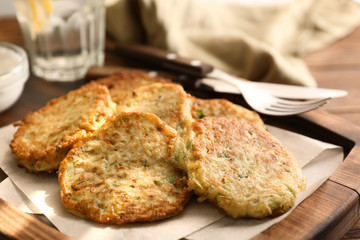 Zucchini pancakes on wooden board