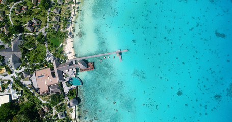 Water bungalows resort at islands, french polynesia in aerial view