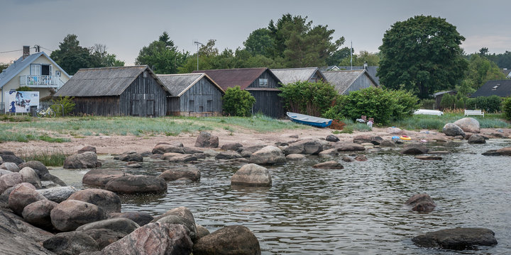 Boulders at the coast of Kasmu. Harbour with fishers' houses on the stoned coast of Baltic sea. Kasmu, village of captains, Estonia. Close-up.
