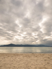 Fototapeta na wymiar Dramatic cloudy sky at Daniela beach - Florianopolis, Brazil