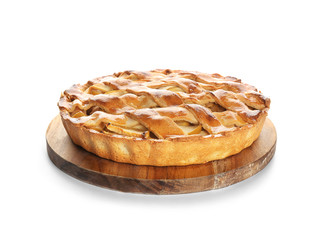 Wooden board with delicious apple pie on white background
