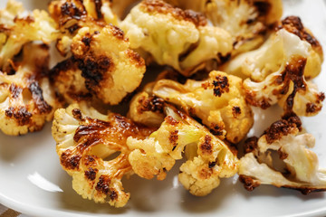 Tasty grilled cauliflower on plate, closeup