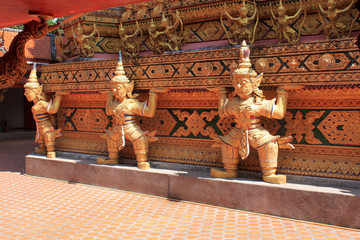 Yak is a mythical creature guarding treasures from bad people. Buddhist temple. Thailand. Phuket.