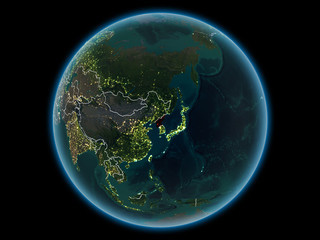 Fototapeta na wymiar North Korea on planet Earth from space at night