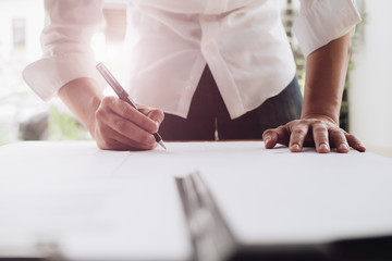 Close up business man reaching out sheet with contract agreement proposing to sign.Full and...