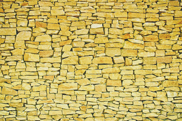 yellow stone wall texture.