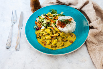 Mussels with curry sauce Rice and salad