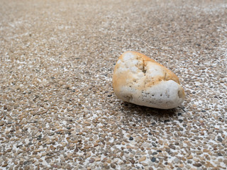 close up of white pebble on gravel floor background