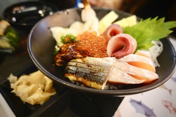 Japanese food. sushi and sashimi big set include salmon, tuna, otoro and lobster, Asian people eating sashimi set in Asian restaurant. Hirame sashimi,salmon sashimi and tuna sashimi dish.
