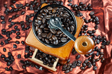 Coffee beans and vintage wooden grinder.