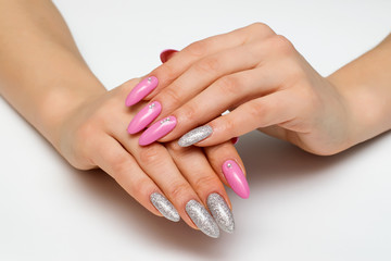 pink silver manicure with Swarovski crystals on long sharp nails
