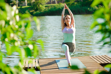 Young slim yoga woman making beautiful asana exercises. Healthy lifestyle. Stretching.