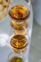 Party and holiday celebration concept. glasses with cognac on the bar counter. 