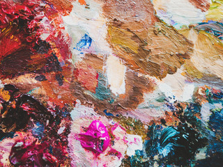 Artists multicolored oil paints on wooden palette or canvas. Close up abstract background. Art concept.