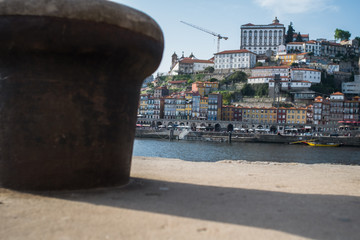 Ribeira district in Porto, Portugal, with a mooring bitt in the foreground.
