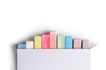 Isolated. Colorful crayons for drawing on a white background. Top view. Copy space. Color chalk