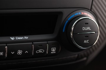 Closeup of Air Conditioning Panel in a Car