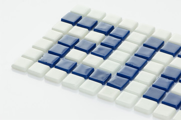 little blue ceramic tile on a white background, majolica. for the catalog