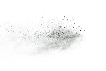 Black powder explosion. Closeup of black dust particles explode isolated on white background.