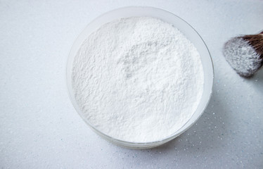 White powder with brush on white background