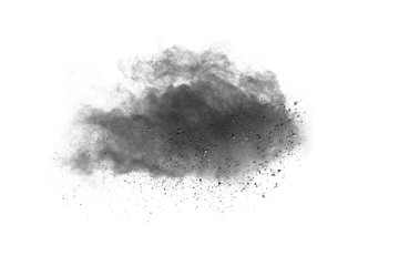 Black powder explosion. Closeup of black dust particles explode isolated on white background.