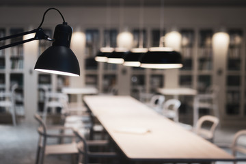 Decorative indoor table lamp hanging on the wall and celing in the meeting room.